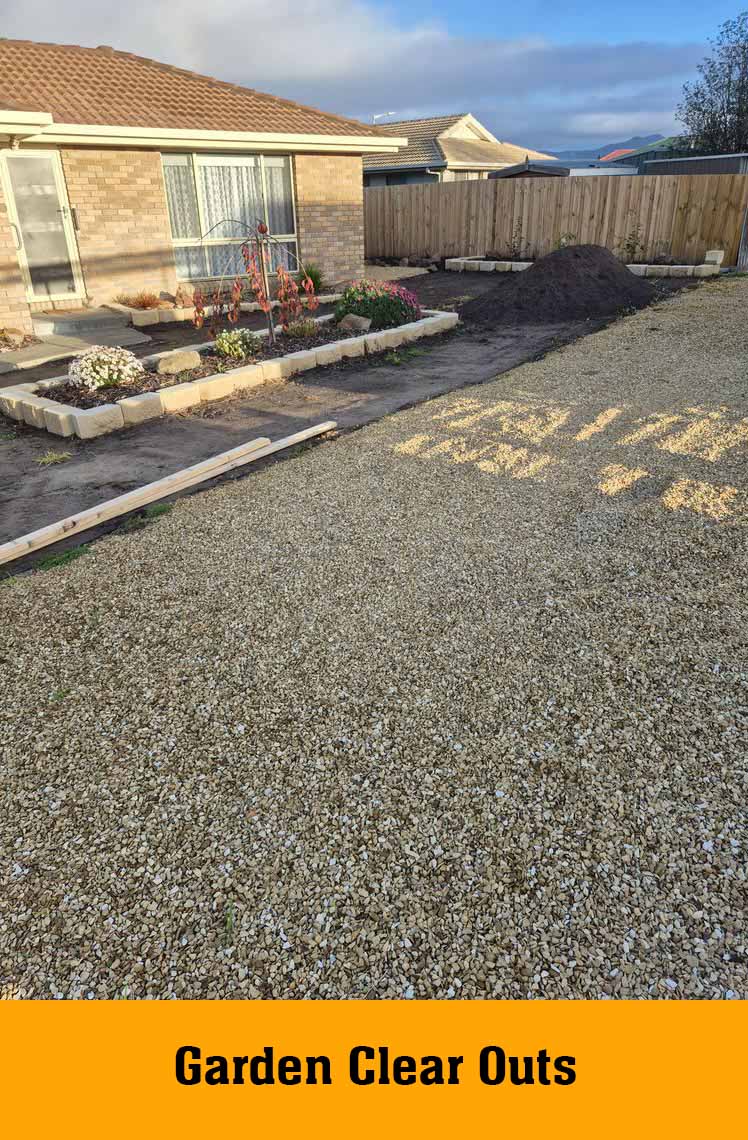 Gravel yard and garden beds in front of a brick house, labelled Garden Clear Outs